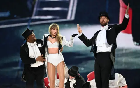 Getty Images Taylor Swift is joined on stage by Travis Kelce, during The Eras Tour at Wembley Stadium on June 23, 2024 in London