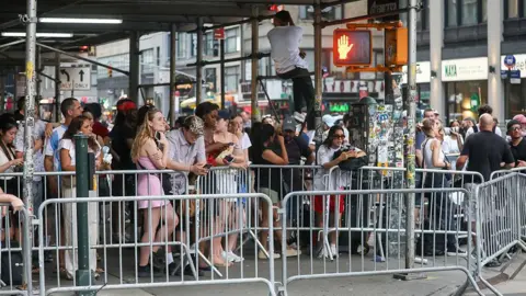 Getty Images People gathered behind barricades near Madison Square Garden