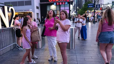 EPA Onlookers react to the wedding announcement