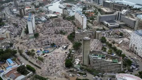 Reuters Destroyed buildings are seen in this aerial photo in Venezuela's northern coastal town of Caraballeda. Photo: 3 July 2026