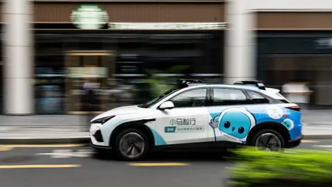 Getty Images A Pony AI Inc. autonomous taxi travels along a road in Shenzhen, China