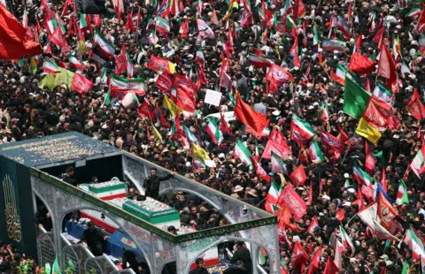 EPA/Shutterstock Iranians taking part in the funeral procession for Ayatollah Ali Khamenei