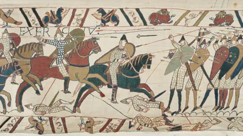 The Making of Heritage in Normandy, Antoine Cazin A section of the Bayeaux Tapesty showing men riding horses and arrows being fired 