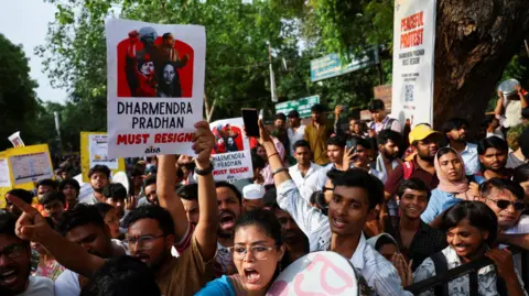 Reuters People hold placards and shout slogans during a sit in protest called by Cockroach Janta Party (CJP) 