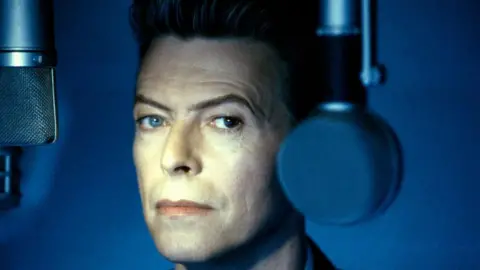 Getty Images David Bowie next to a microphone, photographed later in his career
