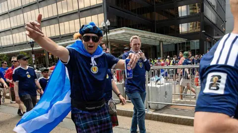 Getty Images Members of the Tartan Army make their way to South Station to board trains to Boston Stadium to watch the upcoming World Cup match between Scotland and Morocco in Boston, Massachusetts, on June 19, 2026. 