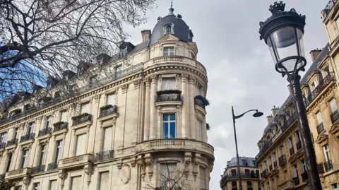Getty Images An exterior view of the building on Avenue Foch where Epstein's apartment was located, showing a grand stone building with a cupola on the corner.
