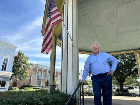 Brandon Drenon Eufaula Mayor Jack Tibbs stands for a portrait beneath a gazebo