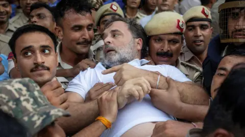 Reuters Indian opposition leader Rahul Gandhi is detained by police during a sit-in protest outside Prime Minister Narendra Modi's residence, demanding accountability for police action against students, in New Delhi, India, July 21, 2026. 