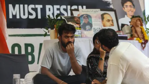 EPA Abhijeet Dipke, founder of the youth-led satirical political movement Cockroach Janta Party (CJP), sits on hunger strike as supporters of CJP protest in New Delhi, India, 19 July 2026. 