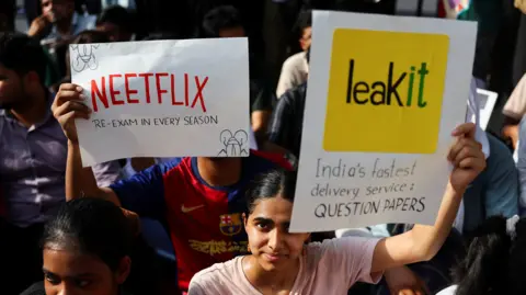 Reuters People hold placards and shout slogans during a sit-in protest called by Cockroach Janta Party (CJP) demanding the resignation of Indian Education Minister Dharmendra Pradhan, at Jantar Mantar in New Delhi, India, June 21, 2026. 