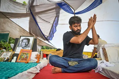 Hindustan Times via Getty Images Cockroach Janata Party founder Abhijeet Dipke during sit-in protest at Jantar Mantar demanding resignation of Union Education Minister Dharmendra Pradhan 