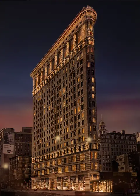 Courtesy of The Flatiron Building rendering of the Flatiron Building seen from the outside at night, with lights illuminating its sides