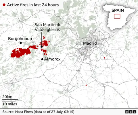 A map shows the location of active fires in the last 24 hours west of Madrid, Spain.