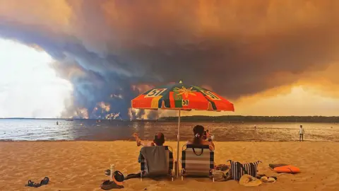 AFP via Getty Images Beach fire. 