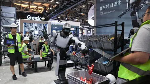 Getty Images Humanoid robots demonstrate picking and material handling