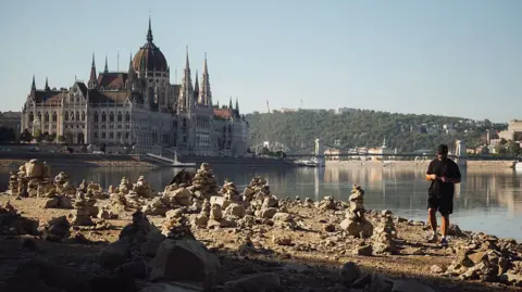 Anadolu via Getty Images A view of the Danube River as it reaches historic record-low water levels in Budapest, Hungary, on July 30, 2026