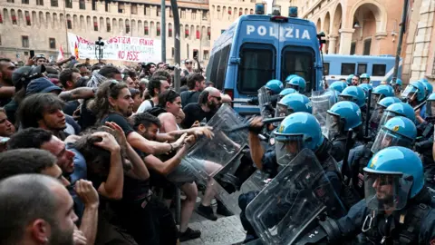 Reuters Protesters clash with riot police during a protest