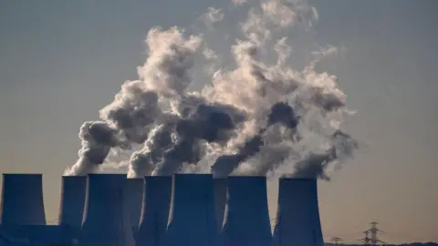 Getty Images Cooling towers release water vapor at the Jaenschwalde lignite-fired power station in Jaenschwalde, Germany