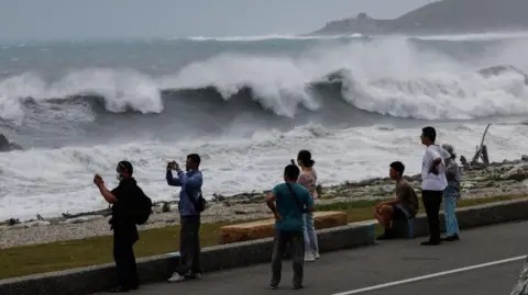 EPA Residents observe huge waves brought by Typhoon Bavi in Hualien city, Taiwan