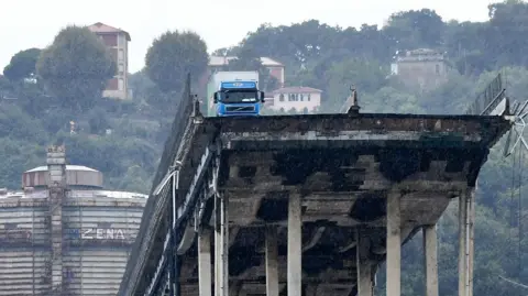 Getty Images A lorry perched on top of the Genoa bridge after its collapse