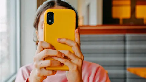 Getty Images Child with mobile phone