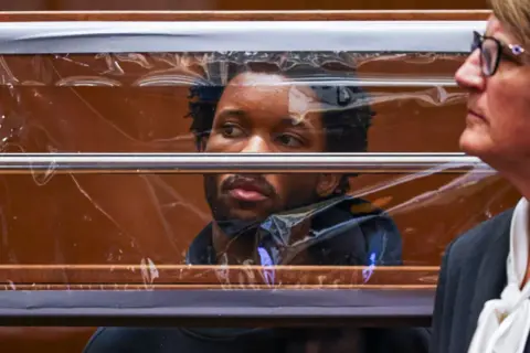 Getty Images d4vd looks on from behind his defense attorney Marilyn Bednarski (R) during his arraignment for the murder of Celeste Rivas Hernandez at Clara Shortridge Foltz Criminal Justice Center on April 20, 2026 in Los Angeles, California