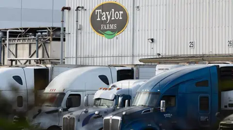 Getty Images view of Taylor Farms building with trucks in front of it