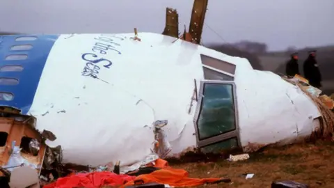Getty Images Officials inspect the wreckage of Pan Am flight 103 December 21, 1988 in Lockerbie, Scotland.