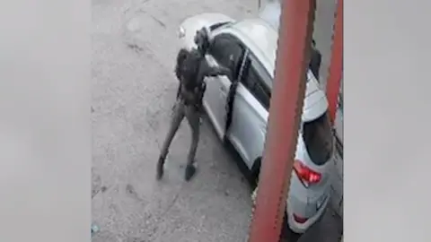 B'Tselem Screengrab of video released by Israeli human rights group B'Tselem showing smoke coming out of a car after an Israeli Border Police officer threw a stun grenade inside, in Qalandia refugee camp, in the occupied West Bank