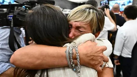 EPA Relatives of the Morandi Bridge victims react after the first-instance verdict in the trial over the collapse of the bridge in Genoa, Italy, 16 July 2026