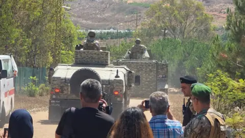 Reuters Lebanese army troops deploy at the entrance of the town of Zawtar al-Gharbiyeh, in southern Lebanon, after Israeli forces withdrew from the area (21 July 2026)