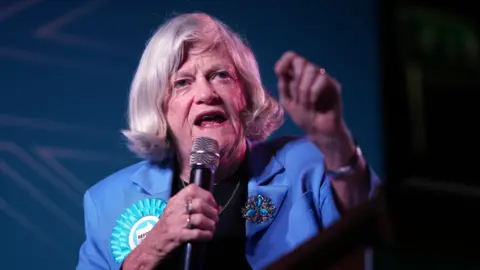 Getty Images Ann Widdecombe, Reform UK's Immigration and Justice spokesperson addresses delegates during the The Reform Uk Party's summer rally at Staffordshire Showground.