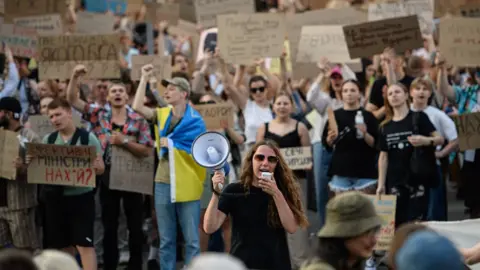 Olga Ivashchenko/Bloomberg via Getty Images Protesters during a demonstration against the dismissal of Mykhailo Fedorov, Ukraine's defense minister, in Kyiv, Ukraine