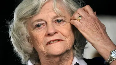 Getty Images Ann Widdecombe speaks at a rally in 2019 - she wearing a white shirt and black top and parting her hair
