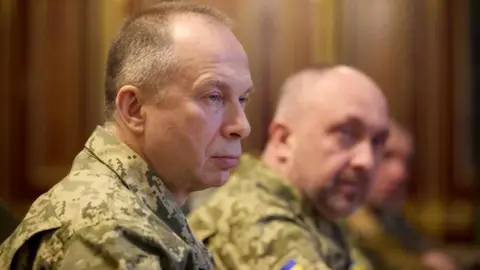 Reuters Side view of Syrsky, who is wearing camouflaged military uniform 