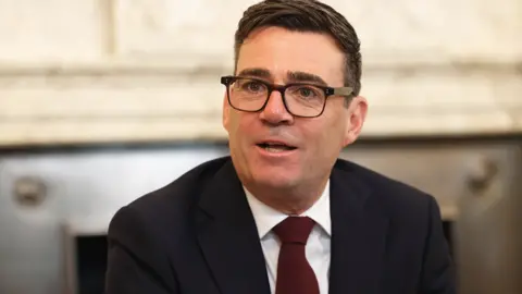 Getty Images Andy Burnham in a black suit at his first cabinet meeting as Prime Minister