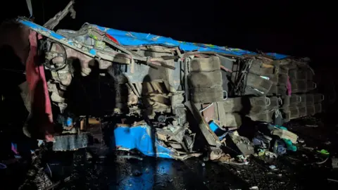 Uganda Police Force/X A wreckage of a bus from an accident 