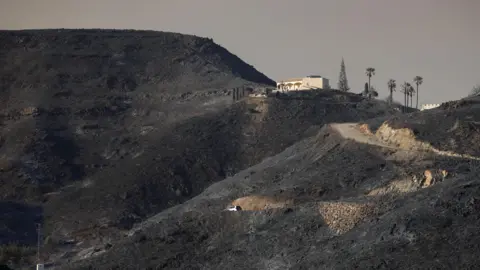Reuters Burnt hills and a single house in the distance after wildfires through Almeria province, Spain.