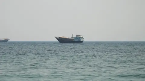 Reuters A vessel in the Strait of Hormuz, as seen from Musandam,Oman.