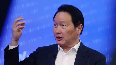 Bloomberg via Getty Images Chey Tae-won, chairman of SK Group, speaking during the company's initial public offering at the Nasdaq MarketSite in New York in July