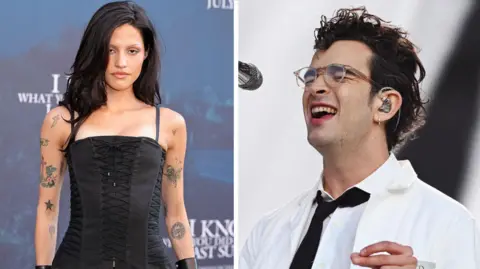 Getty Images/BBC Gabbriette Bechtel on the left wears a black corset and has several tattoos on her arms. Matty Healy, right, performs on stage wearing a white lab coat and glasses. 