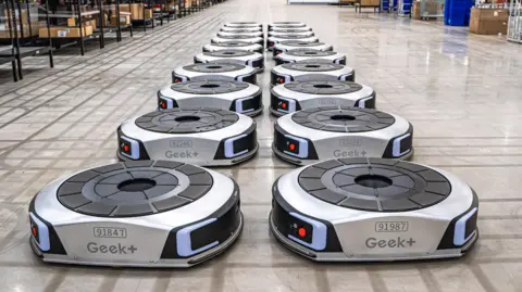 Geek+ Geek+ floor robots lines up in a UK warehouse