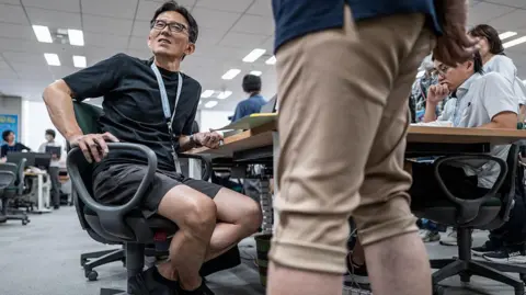 Getty Images Japanese men in the office wearing shorts