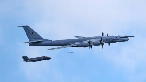 PA Media Handout photo issued by Ministry of Defence of a F-35B fighter launched from HMS Prince of Wales intercepting a Russian Tupolev Tu-142 maritime reconnaissance and anti-submarine warfare (ASW) aircraft.