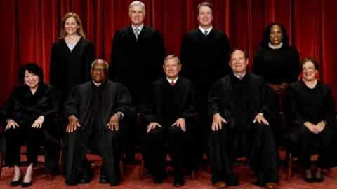 Reuters Seated (L-R): Justices Sonia Sotomayor, Clarence Thomas, Chief Justice John Roberts, Samuel Alito, and Elena Kagan 
Standing (L-R): Justices Amy Coney Barrett, Neil Gorsuch, Brett Kavanaugh and Ketanji Brown Jackson