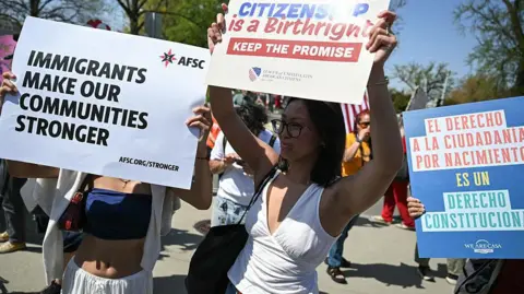 AFP via Getty Images Demonstrators rally in support of birthright citizenship outside the US Supreme Court in Washington, DC on April 1