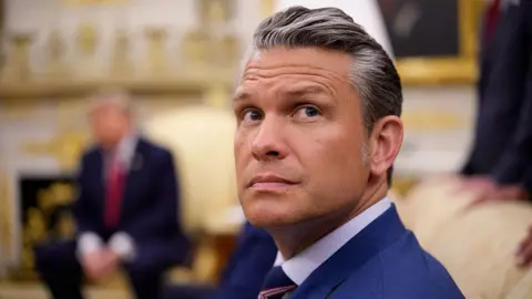 Getty Images Secretary of War Pete Hegseth attends a meeting with U.S. President Donald Trump and Prime Minister of Iraq Ali al-Zaidi in the Oval Office of the White House on July 14, 2026 in Washington, DC.