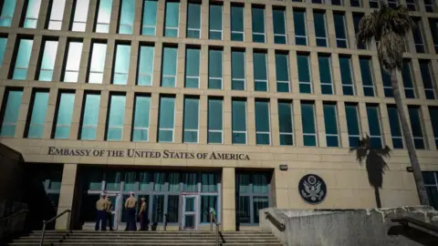 Getty Images US Marines stand outside the Embassy of the United State of America in Havana, on February 21, 2018