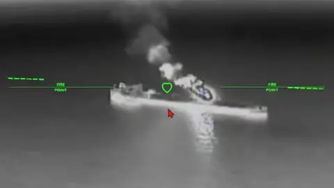 Magyar/Social media A still image of an oil tanker under attack from a drone in a black and while nighttime image